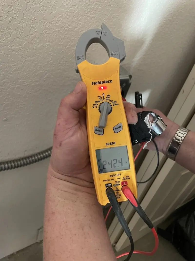 Voltage testing with clamp meter during Circuit Breaker Repair in Gatlinburg